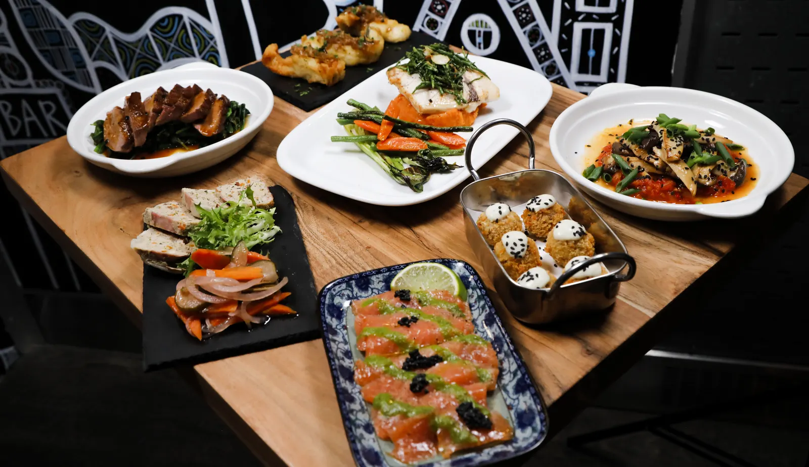 A table at Cajou covered with sharing tapas